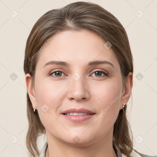 Joyful white young-adult female with medium  brown hair and grey eyes