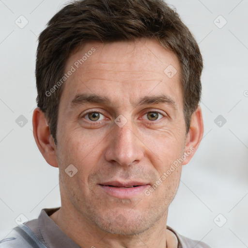 Joyful white adult male with short  brown hair and grey eyes