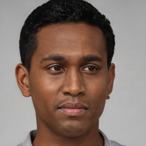 Neutral black young-adult male with short  black hair and brown eyes