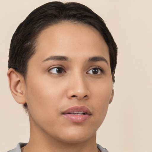 Joyful latino young-adult female with short  brown hair and brown eyes