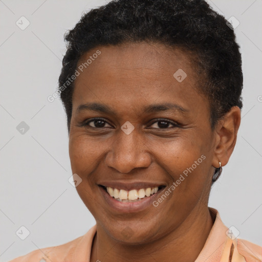 Joyful latino young-adult female with short  brown hair and brown eyes