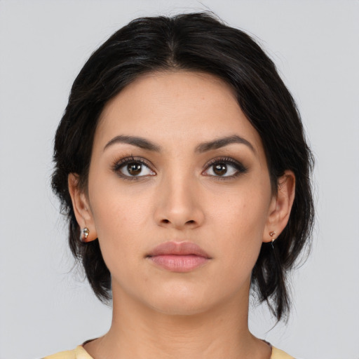 Neutral latino young-adult female with medium  black hair and brown eyes