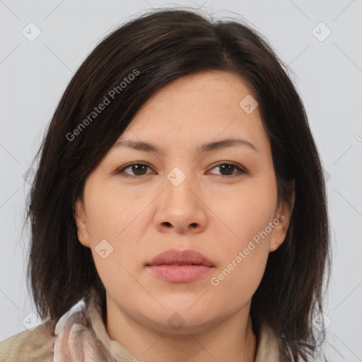 Joyful asian young-adult female with medium  brown hair and brown eyes