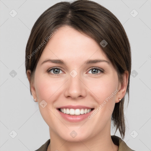 Joyful white young-adult female with medium  brown hair and grey eyes