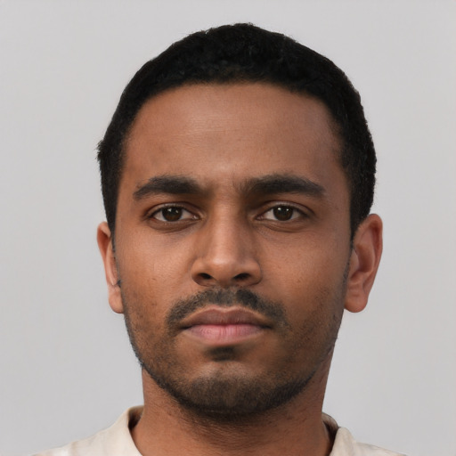 Neutral black young-adult male with short  black hair and brown eyes