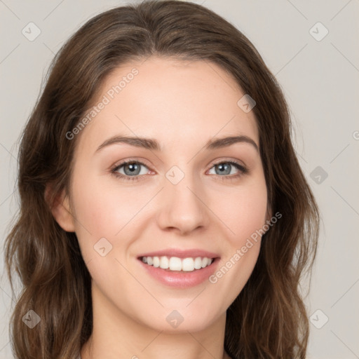 Joyful white young-adult female with long  brown hair and green eyes