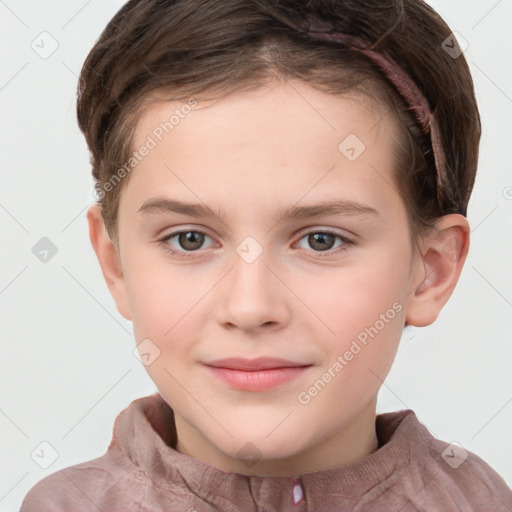 Joyful white child female with short  brown hair and grey eyes