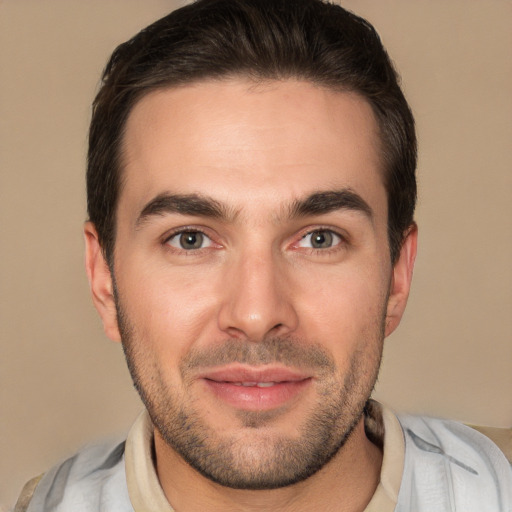 Joyful white young-adult male with short  brown hair and brown eyes