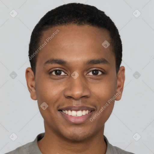 Joyful black young-adult male with short  brown hair and brown eyes