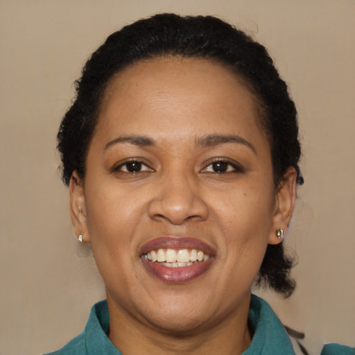 Joyful black adult female with short  brown hair and brown eyes