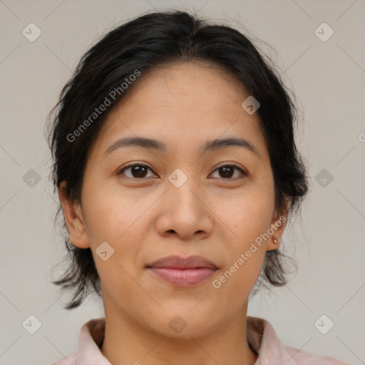 Joyful latino young-adult female with medium  brown hair and brown eyes