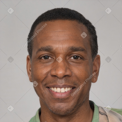 Joyful latino adult male with short  black hair and brown eyes