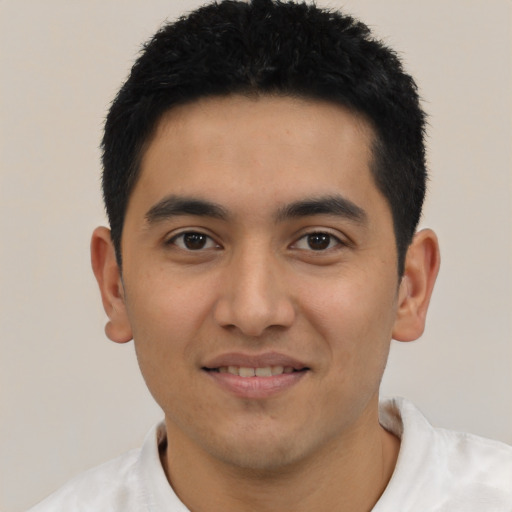 Joyful asian young-adult male with short  black hair and brown eyes