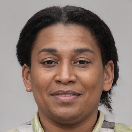 Joyful latino adult female with short  brown hair and brown eyes