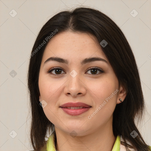 Joyful latino young-adult female with medium  brown hair and brown eyes