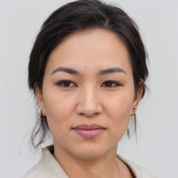 Joyful asian young-adult female with medium  brown hair and brown eyes