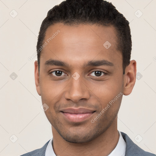 Joyful black young-adult male with short  brown hair and brown eyes