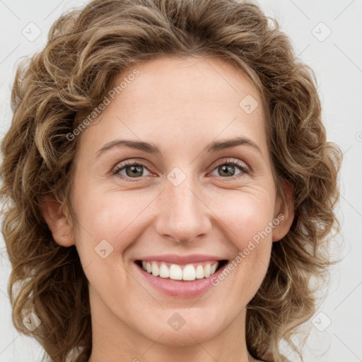 Joyful white young-adult female with medium  brown hair and green eyes