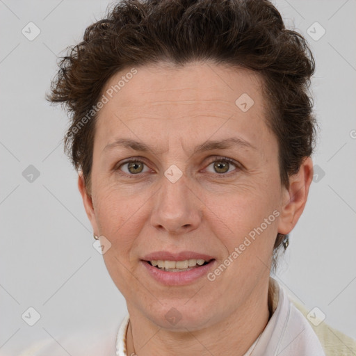 Joyful white adult female with short  brown hair and brown eyes