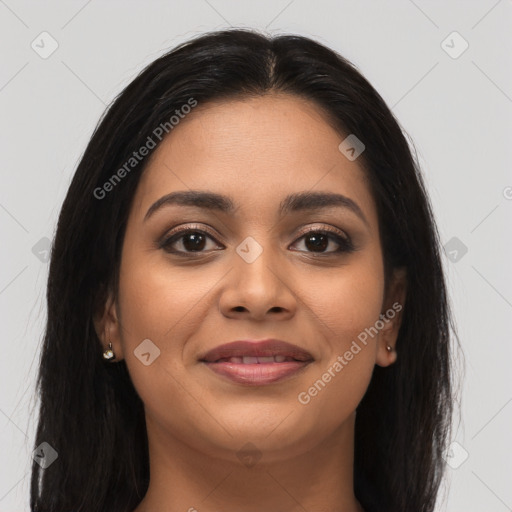 Joyful latino young-adult female with long  brown hair and brown eyes