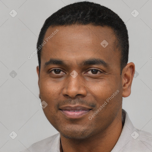 Joyful black young-adult male with short  black hair and brown eyes