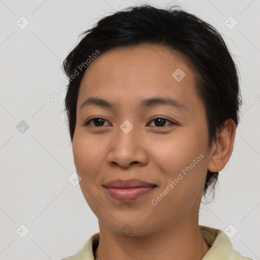 Joyful asian young-adult female with short  brown hair and brown eyes