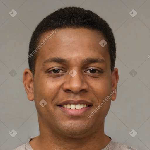 Joyful latino young-adult male with short  brown hair and brown eyes