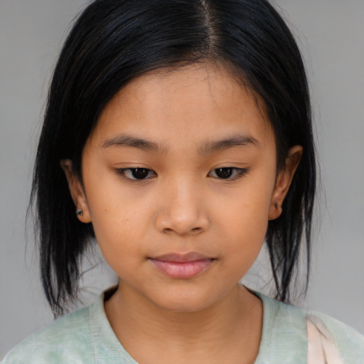 Joyful asian child female with medium  brown hair and brown eyes