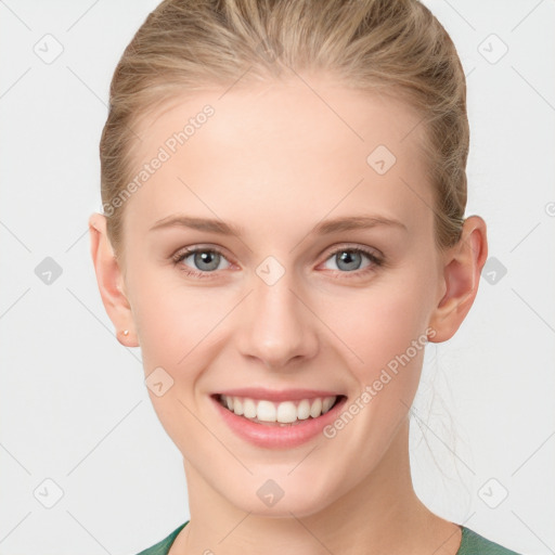 Joyful white young-adult female with medium  brown hair and blue eyes