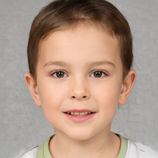 Joyful white child female with short  brown hair and brown eyes