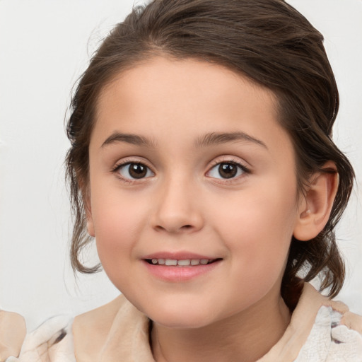 Joyful white child female with medium  brown hair and brown eyes