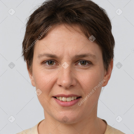 Joyful white adult female with short  brown hair and grey eyes