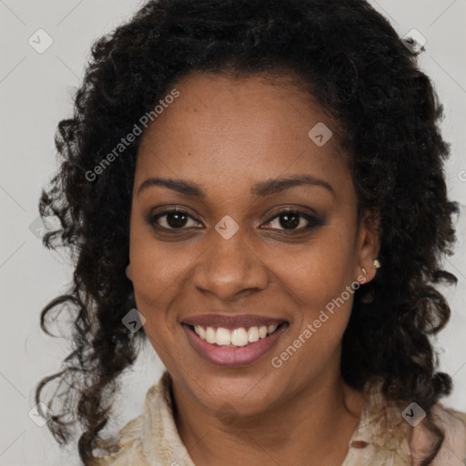 Joyful black young-adult female with long  brown hair and brown eyes