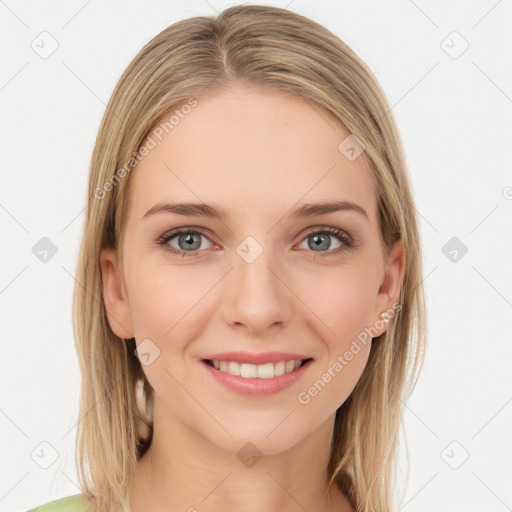 Joyful white young-adult female with long  brown hair and green eyes