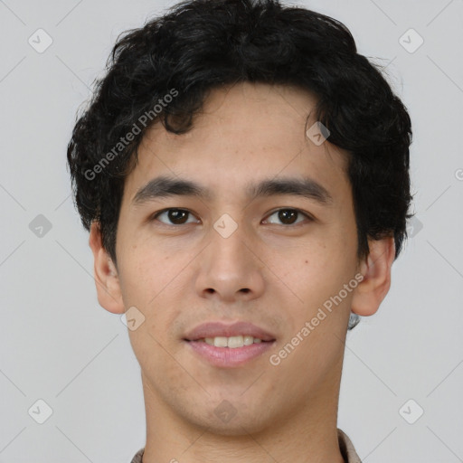 Joyful latino young-adult male with short  brown hair and brown eyes