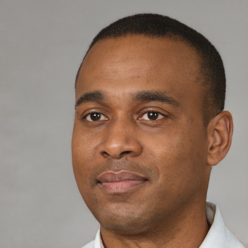Neutral black young-adult male with short  black hair and brown eyes