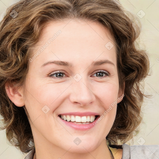 Joyful white young-adult female with medium  brown hair and green eyes