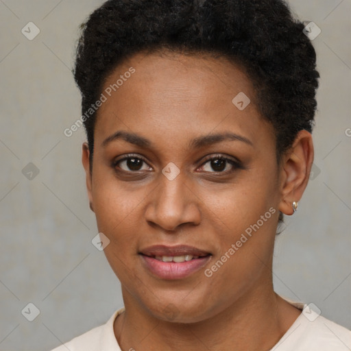 Joyful black young-adult female with short  brown hair and brown eyes