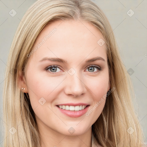 Joyful white young-adult female with long  brown hair and blue eyes