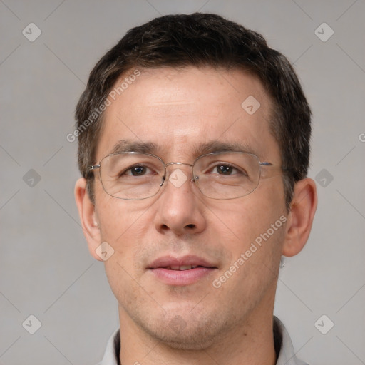 Joyful white adult male with short  brown hair and brown eyes