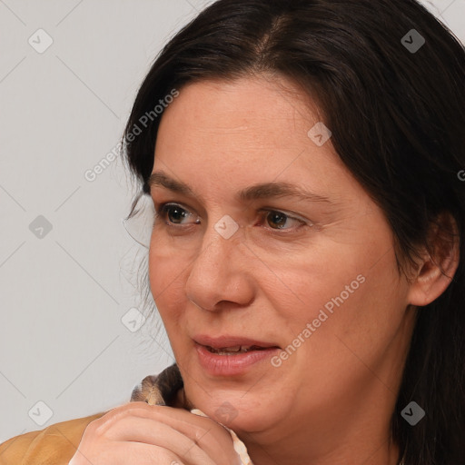 Joyful white adult female with medium  brown hair and brown eyes