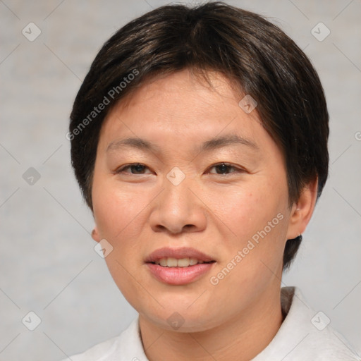 Joyful asian young-adult female with short  brown hair and brown eyes