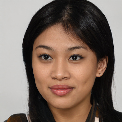 Joyful asian young-adult female with medium  brown hair and brown eyes