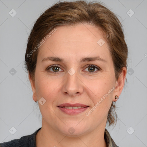 Joyful white adult female with medium  brown hair and grey eyes