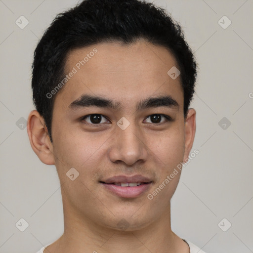 Joyful latino young-adult male with short  brown hair and brown eyes