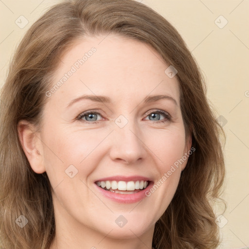 Joyful white young-adult female with long  brown hair and green eyes