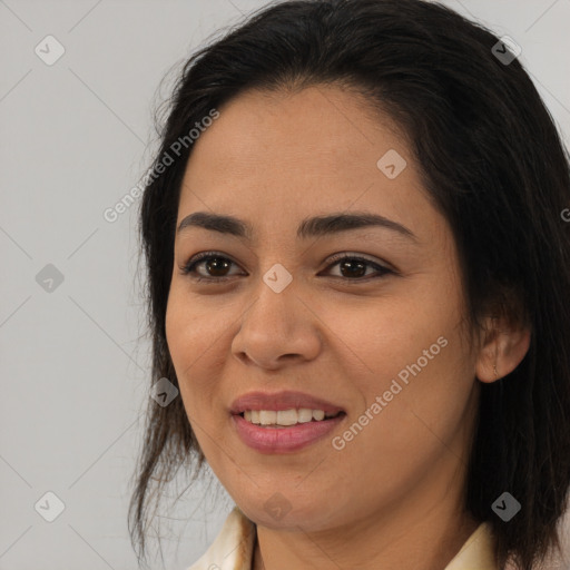 Joyful asian young-adult female with long  brown hair and brown eyes