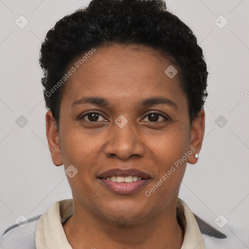 Joyful black young-adult female with short  black hair and brown eyes