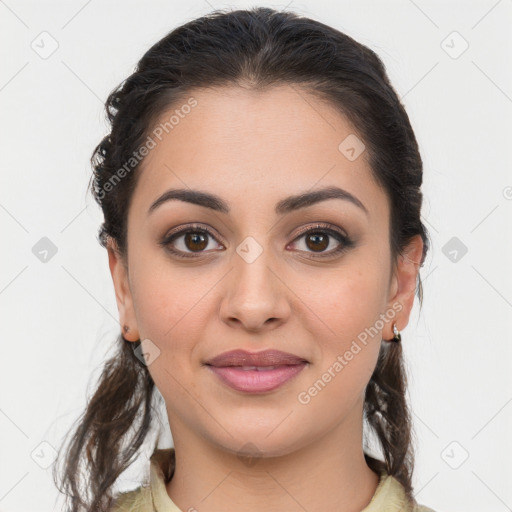 Joyful latino young-adult female with long  brown hair and brown eyes