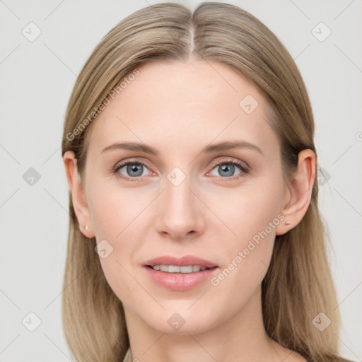 Joyful white young-adult female with long  brown hair and blue eyes